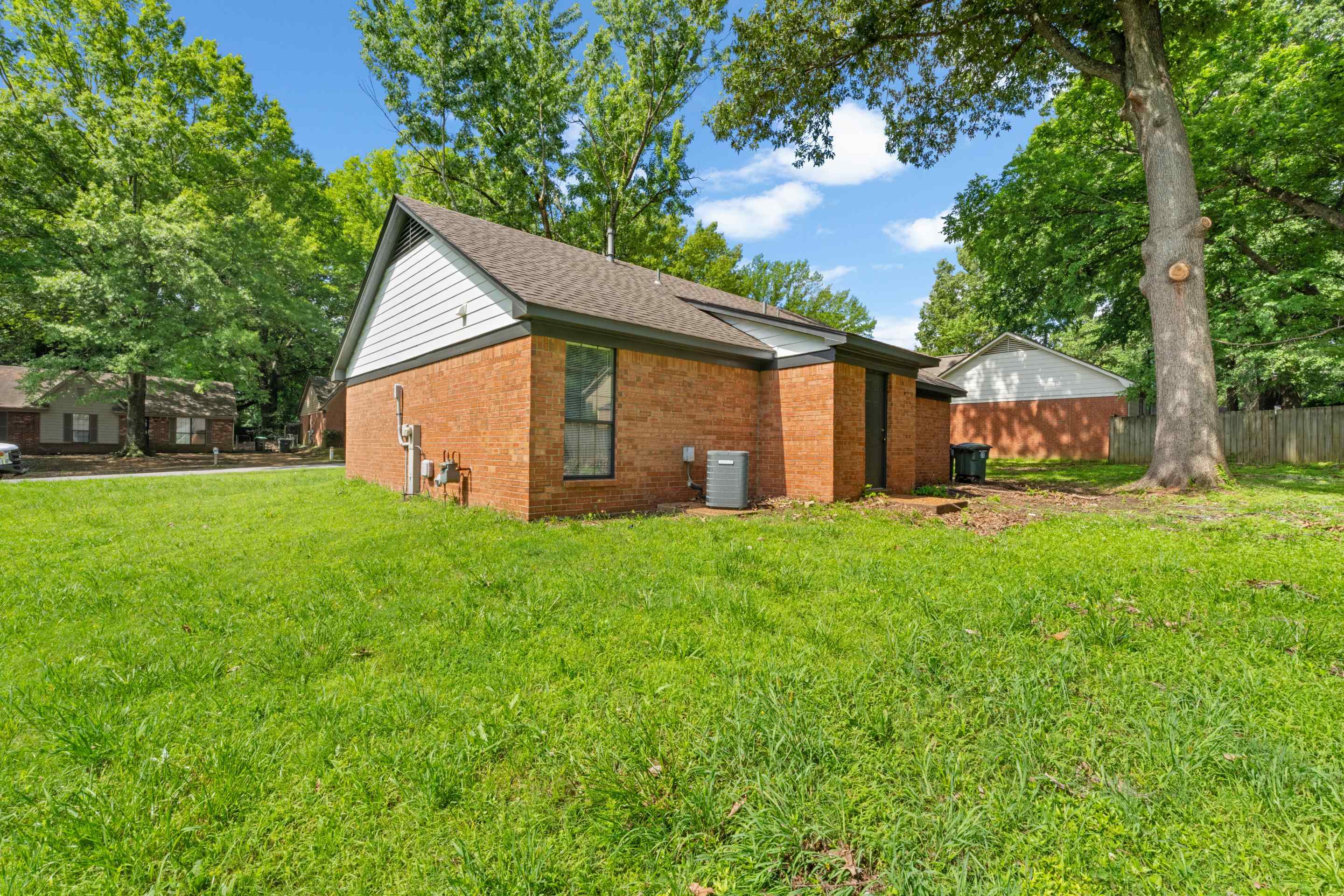 6400 Saginaw Road Memphis, TN 38134 - Photo 24 of 27 Situated on a generous corner lot, this property offers plenty of outdoor space, mature trees, and room for gardening, pets, or future outdoor entertaining.