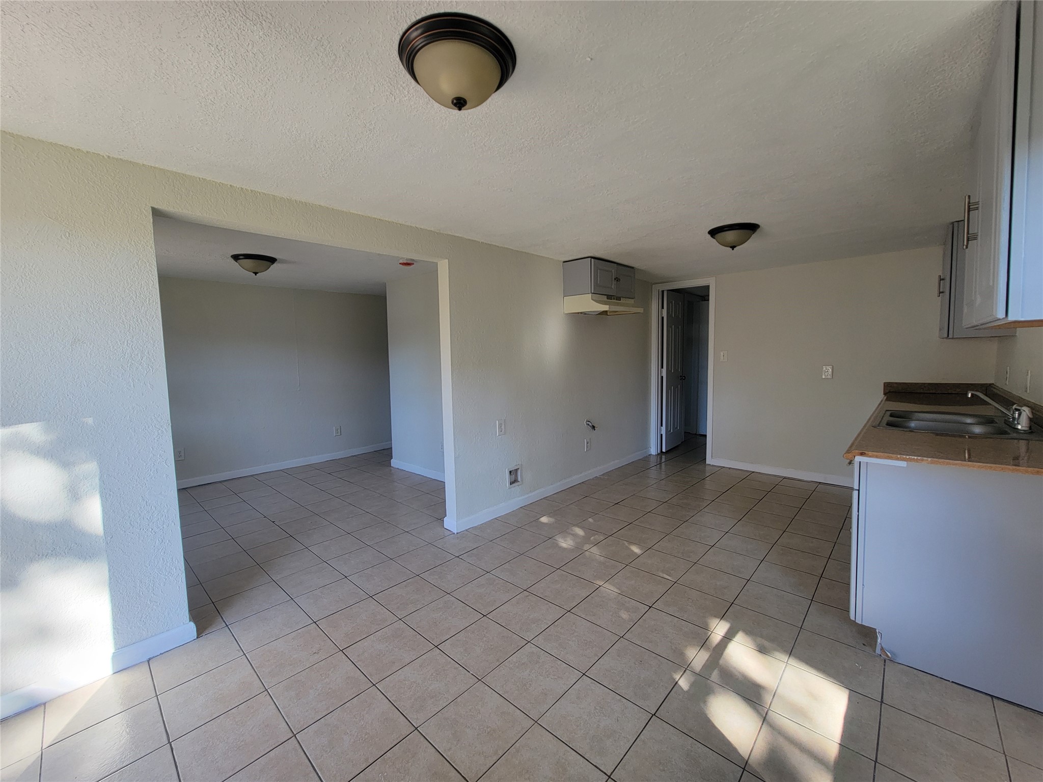 733 Zoe Street Houston, TX 77020 - Photo 5 of 15 a view of a livingroom with an empty space and a window