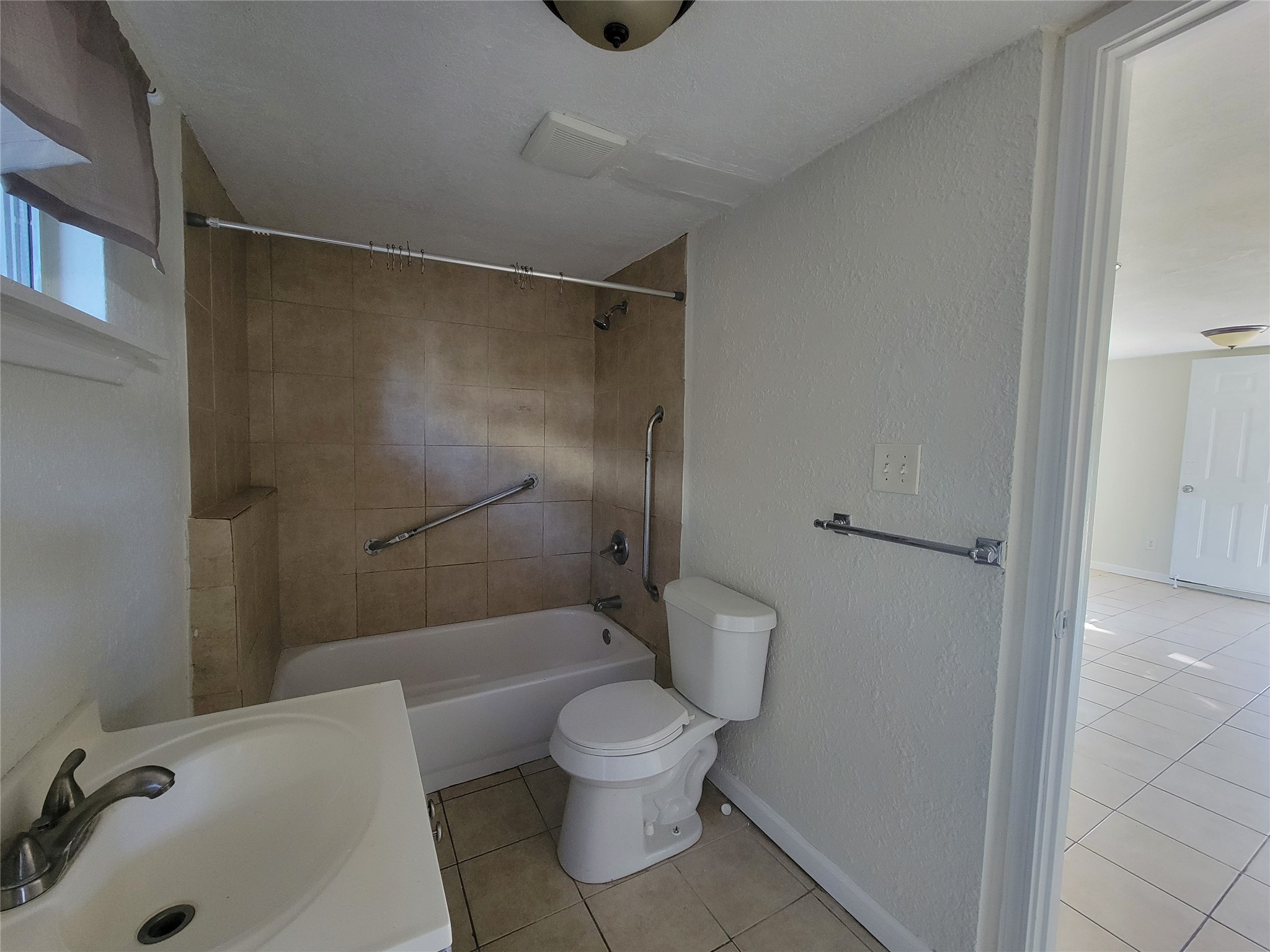 733 Zoe Street Houston, TX 77020 - Photo 8 of 15 a bathroom with a toilet and a shower