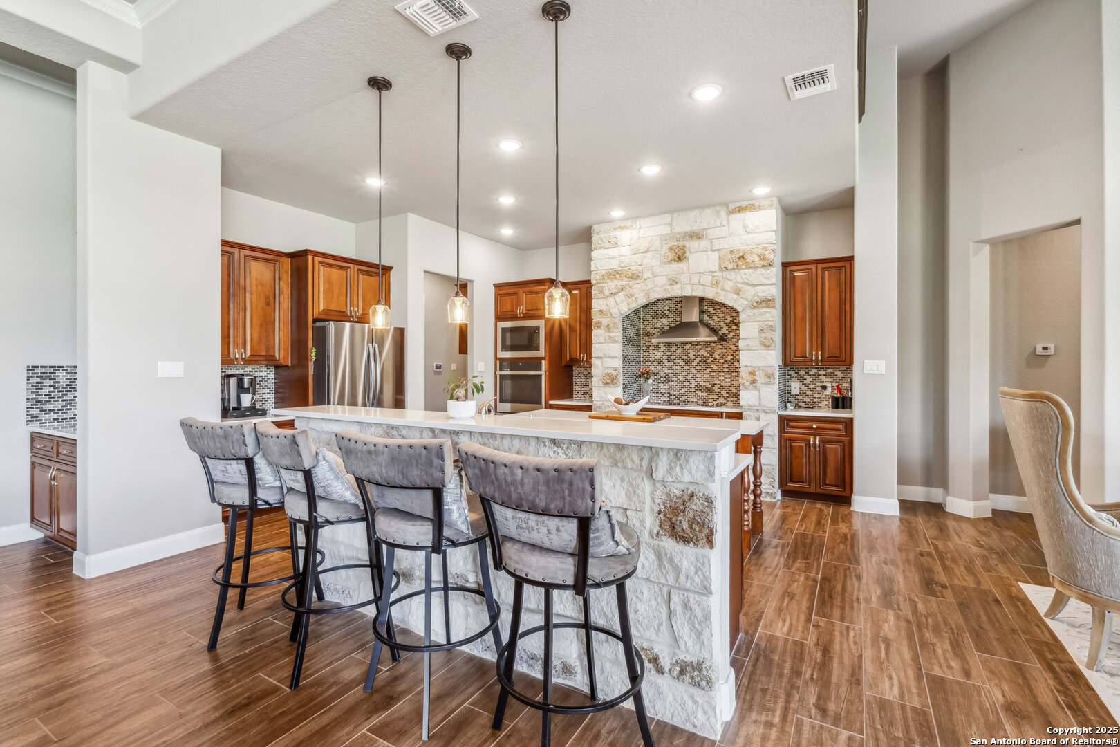 2319 Cascada Parkway Spring Branch, TX 78070 - Photo 12 of 32 a dining table chairs and a chandelier