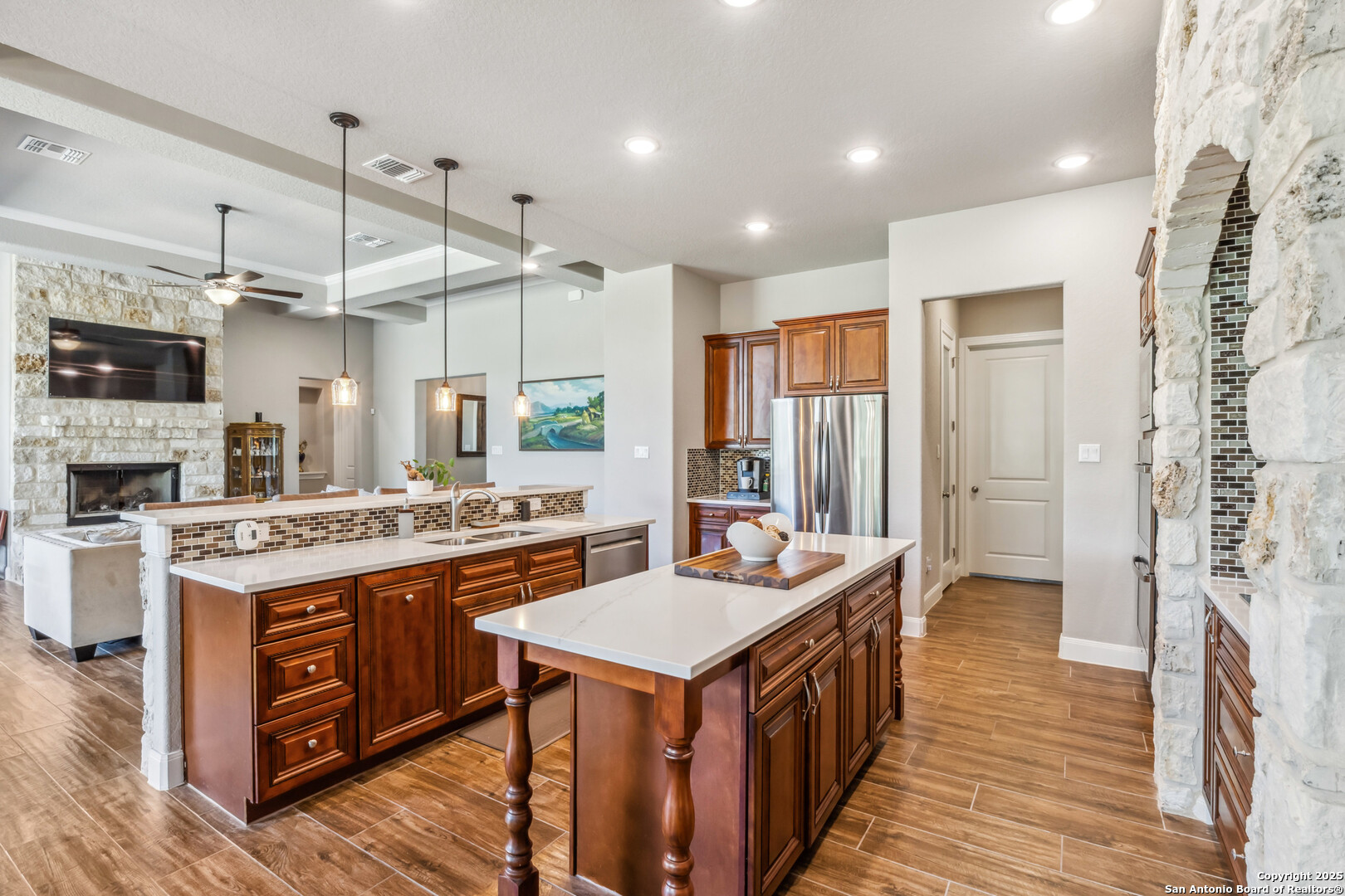 2319 Cascada Parkway Spring Branch, TX 78070 - Photo 13 of 32 a kitchen with a stove and a refrigerator