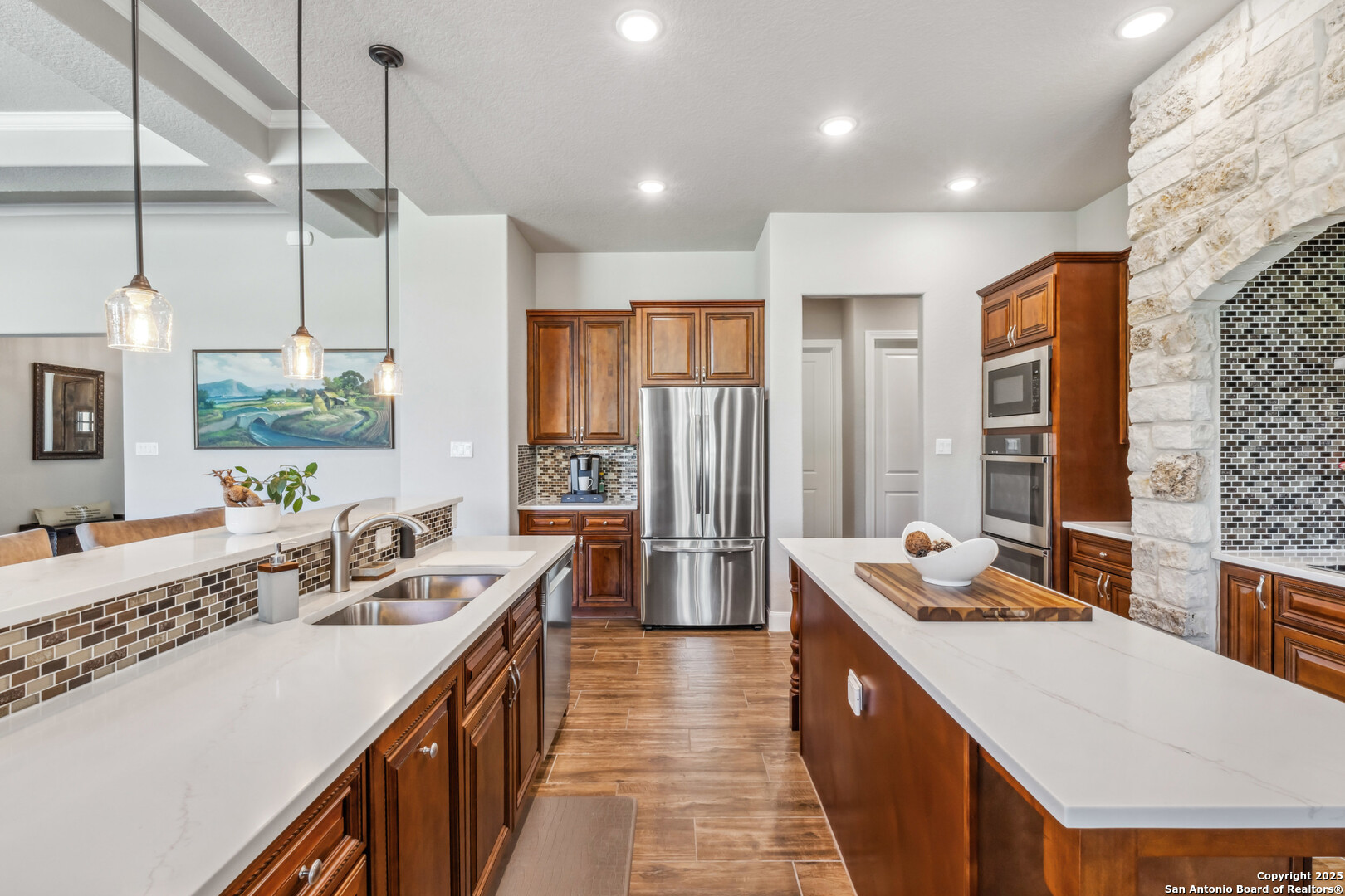 2319 Cascada Parkway Spring Branch, TX 78070 - Photo 14 of 32 a bathroom with a double vanity sink a large mirror and a bathtub