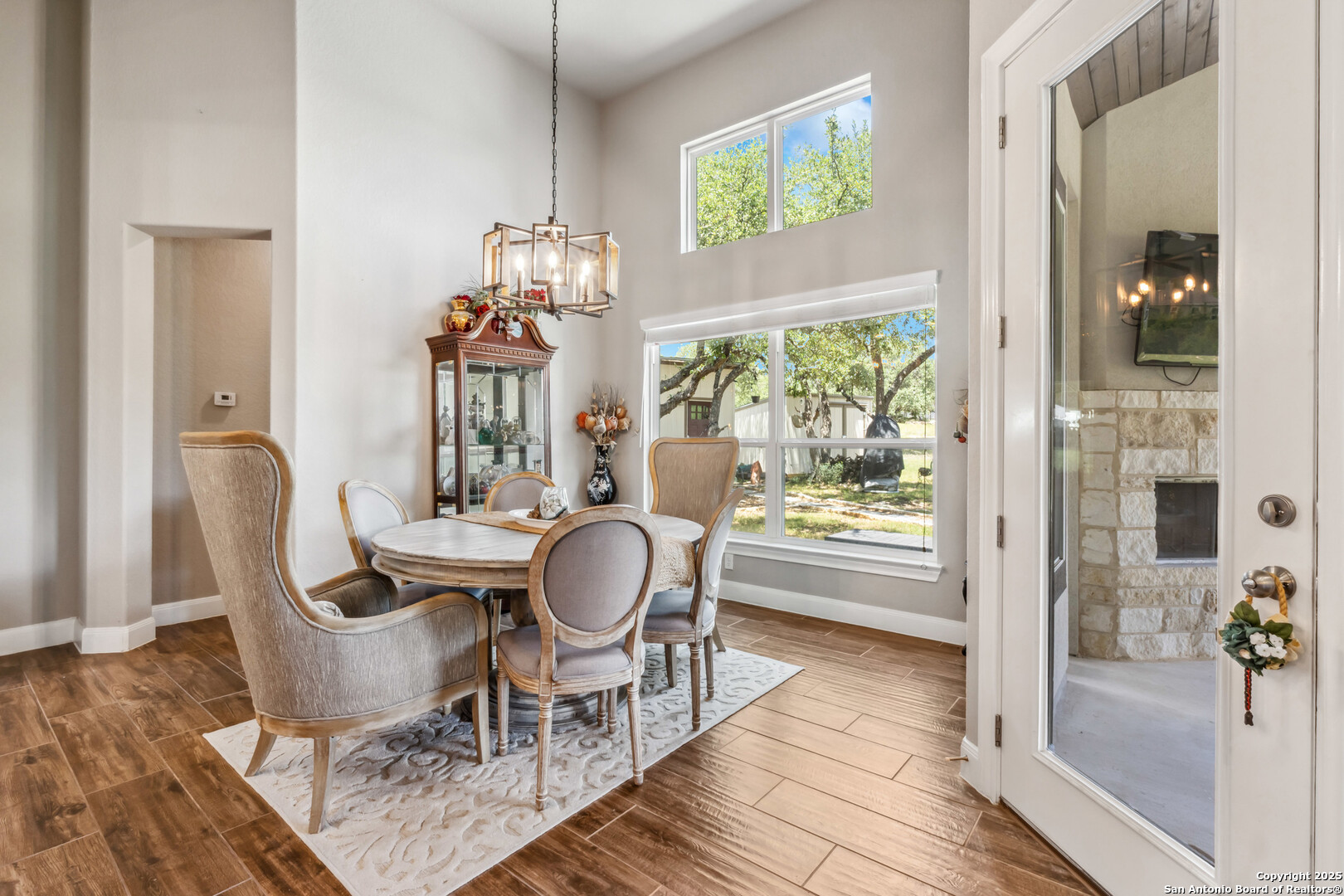 2319 Cascada Parkway Spring Branch, TX 78070 - Photo 15 of 32 a dining room with furniture and wooden floor