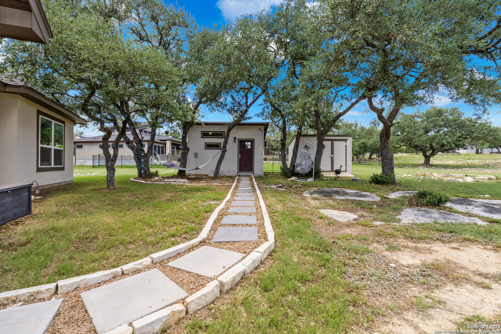 2319 Cascada Parkway Spring Branch, TX 78070 - Photo 25 of 32 a view of a house with a yard