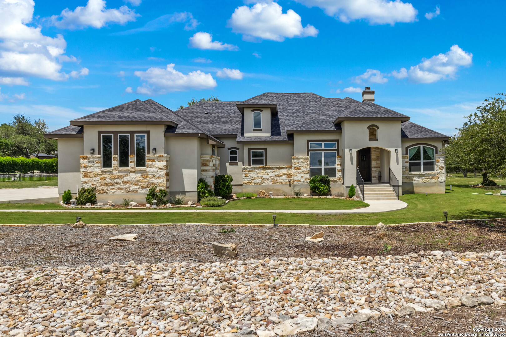 2319 Cascada Parkway Spring Branch, TX 78070 - Photo 5 of 32 a front view of a house with a yard