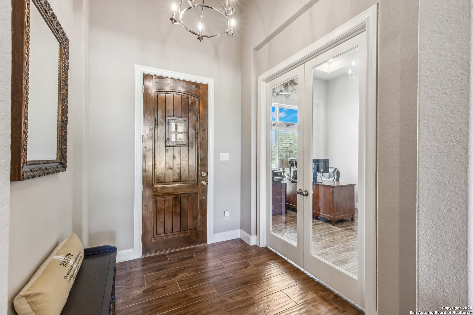 2319 Cascada Parkway Spring Branch, TX 78070 - Photo 9 of 32 a view of a hallway with wooden floor and a bathroom