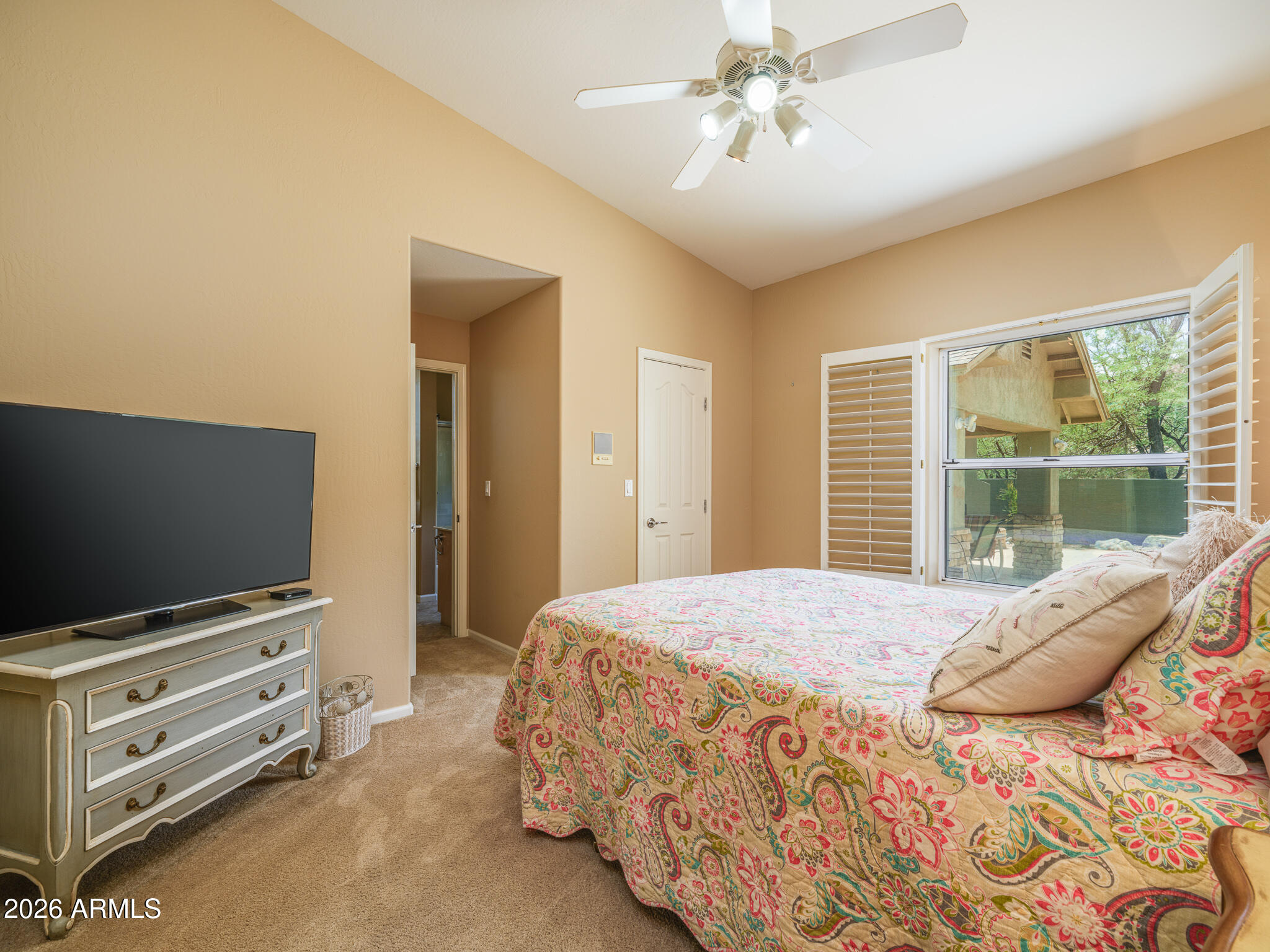 2329 East Hatcher Road Phoenix, AZ 85028 - Photo 23 of 40 a bedroom with a bed and a flat screen tv