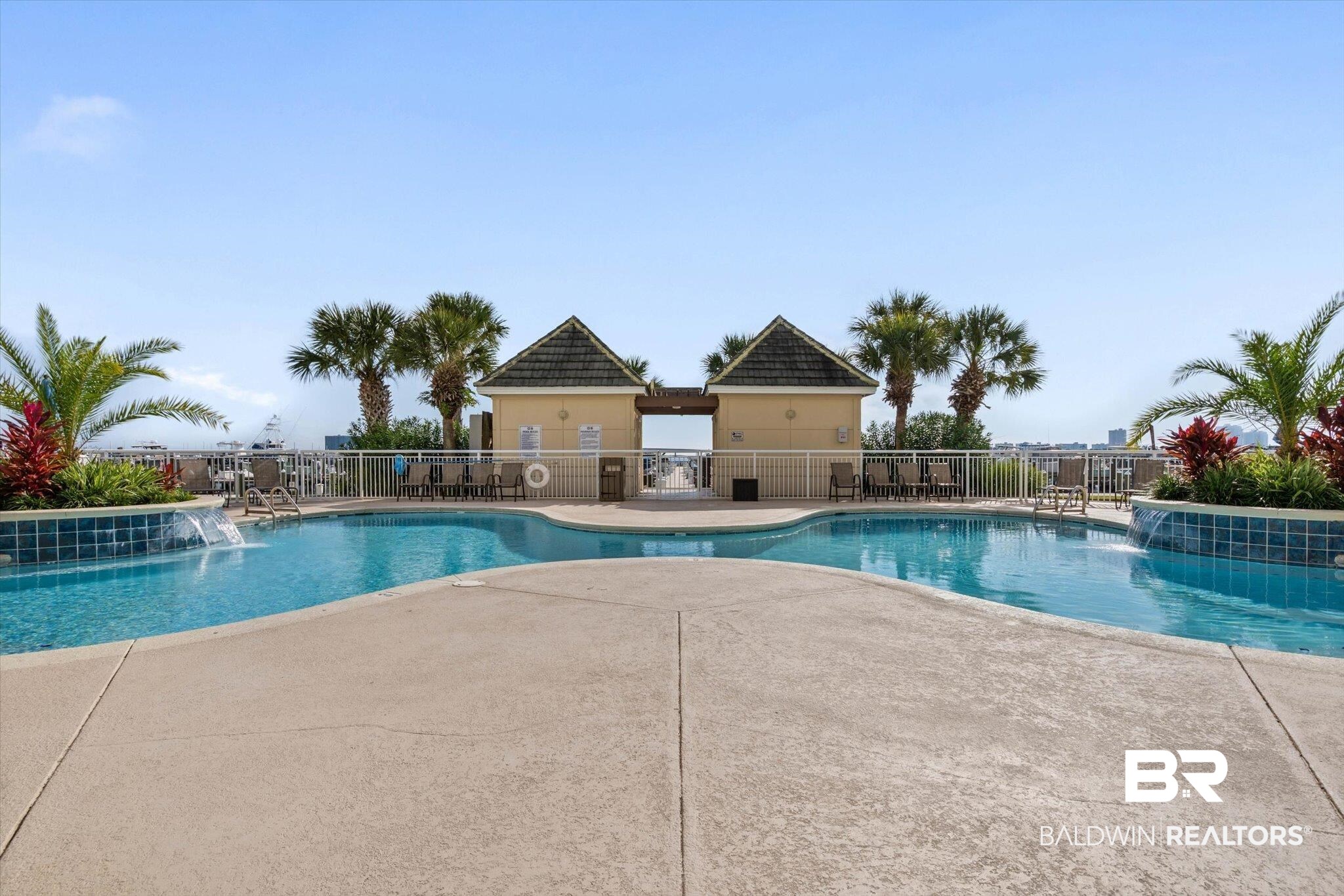 27770 Canal Road, Unit 2102 Orange Beach, AL 36561 - Photo 14 of 19 Community pool featuring a patio