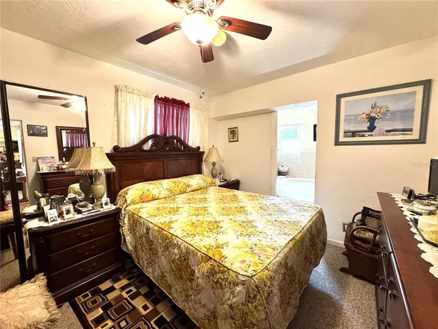 a bed sitting in a room next to a window