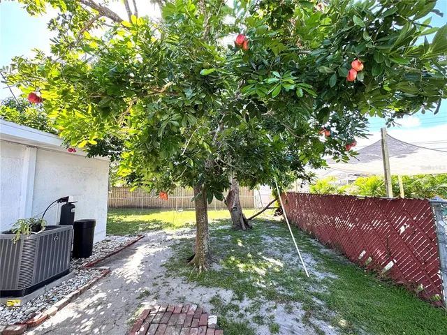 a view of a yard with an outdoor space