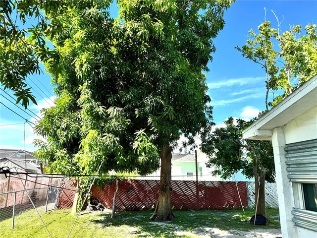 a view of backyard with a patio