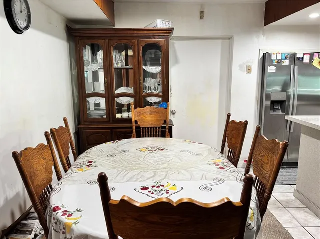a view of a dining room with furniture and window