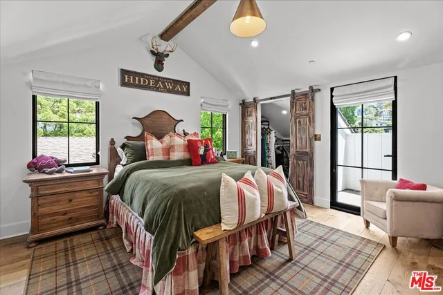 a bed room with a bed and a window