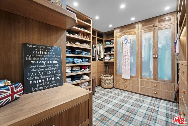 a book shelf with wooden floor