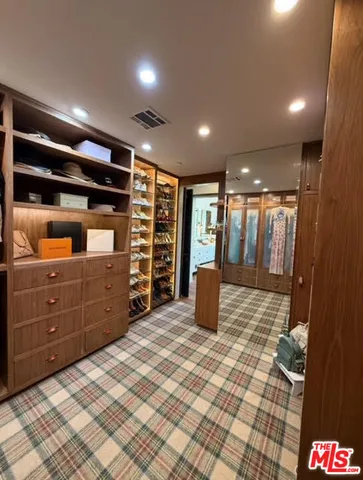 a view of an empty room with a fireplace