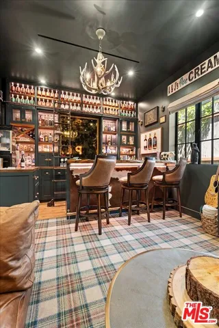 a view of a livingroom with furniture and staircase