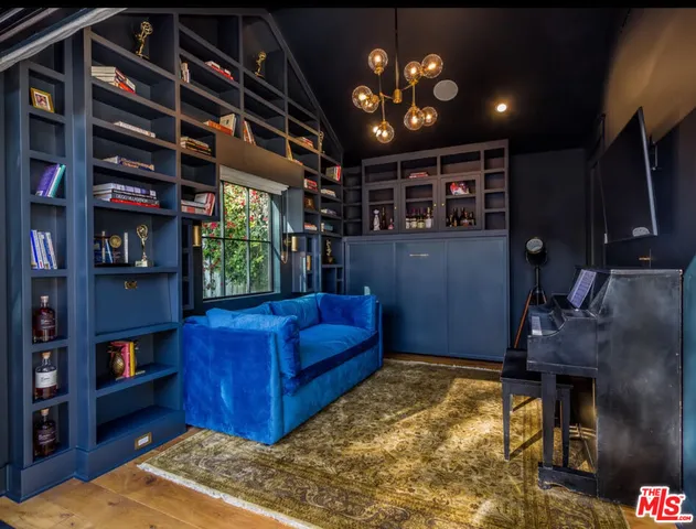 a view of a house with backyard porch and sitting area