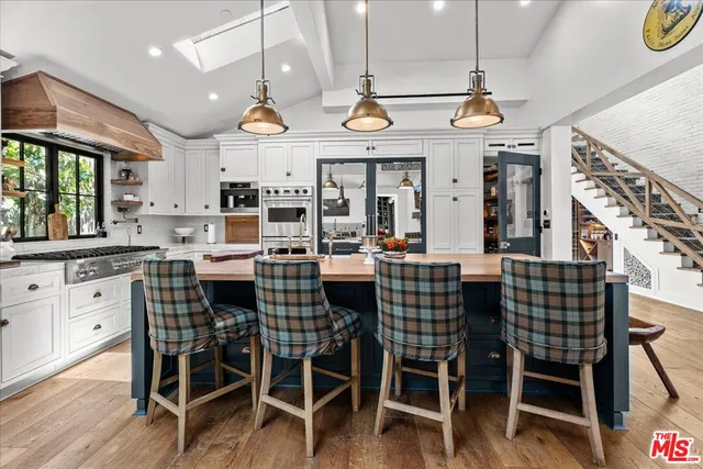 a view of a dining area with furniture window and wooden floor