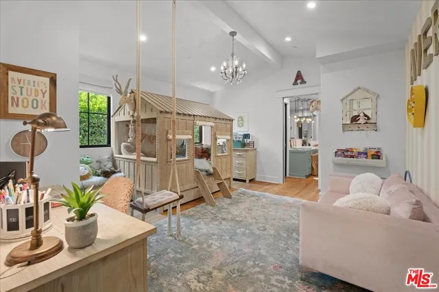 a living room with furniture and a table
