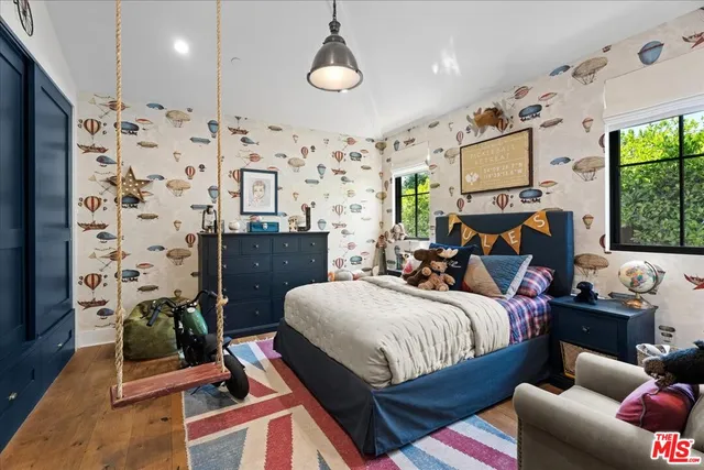 a bedroom with bed and window