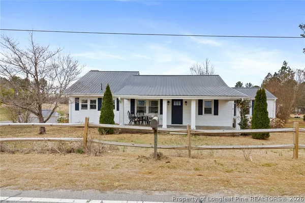 front view of a house with a small yard