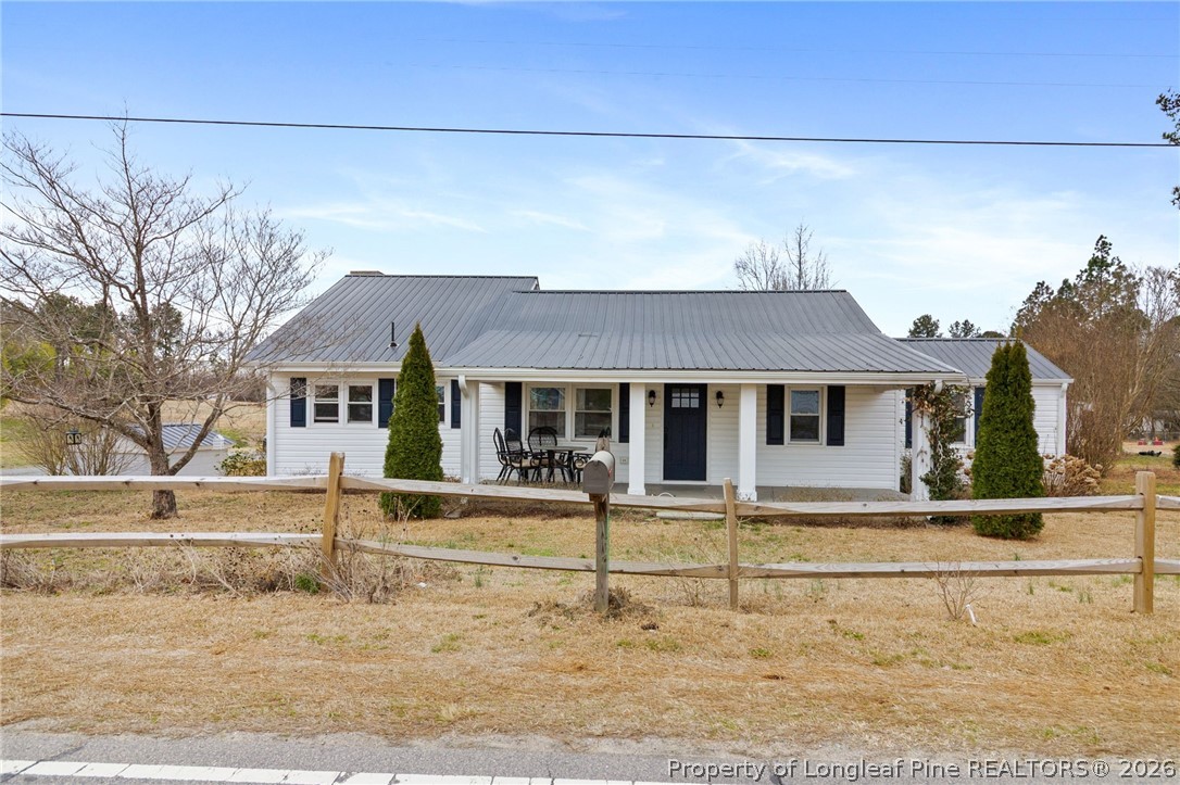front view of a house with a small yard