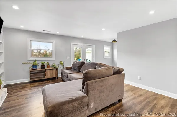 a living room with furniture and a window