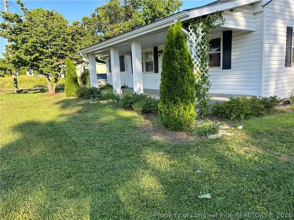 a view of a garden with a fountain