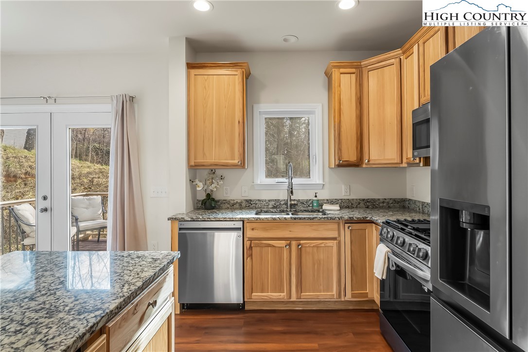 262 Old Bristol Road Boone, NC 28607 - Photo 4 of 38 a kitchen with stainless steel appliances granite countertop a stove a sink and a microwave