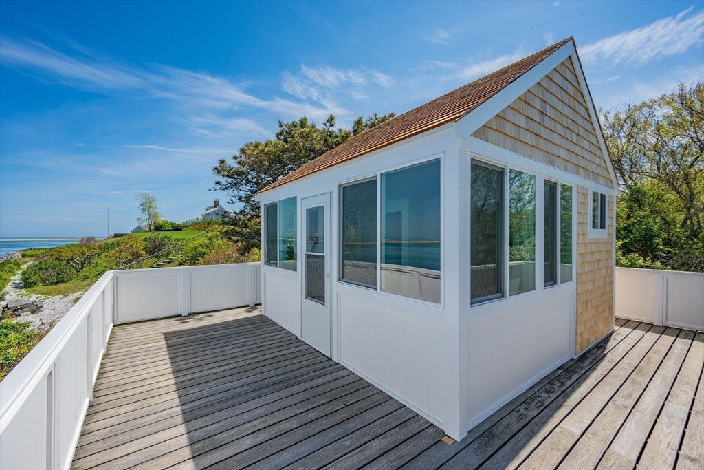 108 Shore Road Chatham, MA 02633 - Photo 11 of 32 a view of a house with a porch