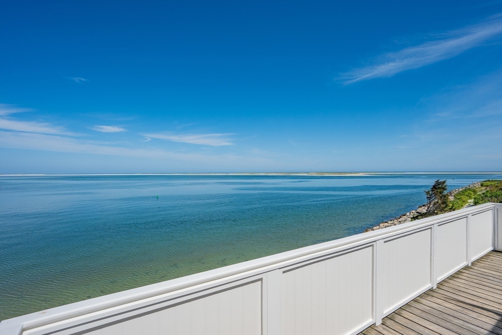 108 Shore Road Chatham, MA 02633 - Photo 12 of 32 a view of a lake from a balcony