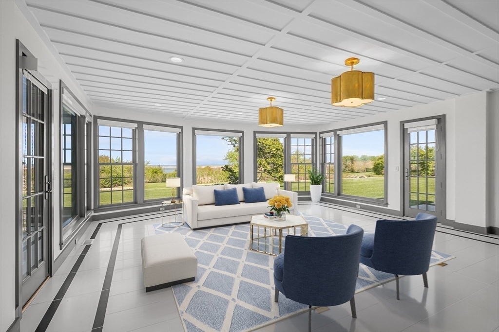 108 Shore Road Chatham, MA 02633 - Photo 16 of 32 a living room with furniture and a large window
