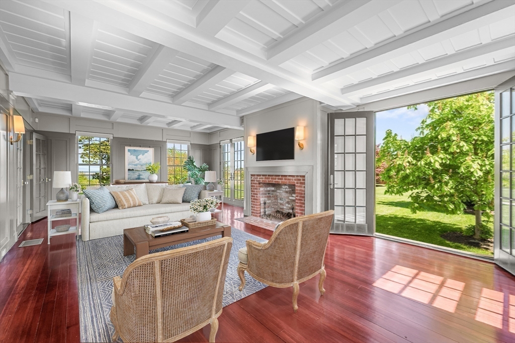 108 Shore Road Chatham, MA 02633 - Photo 18 of 32 a living room with fireplace furniture and a large window