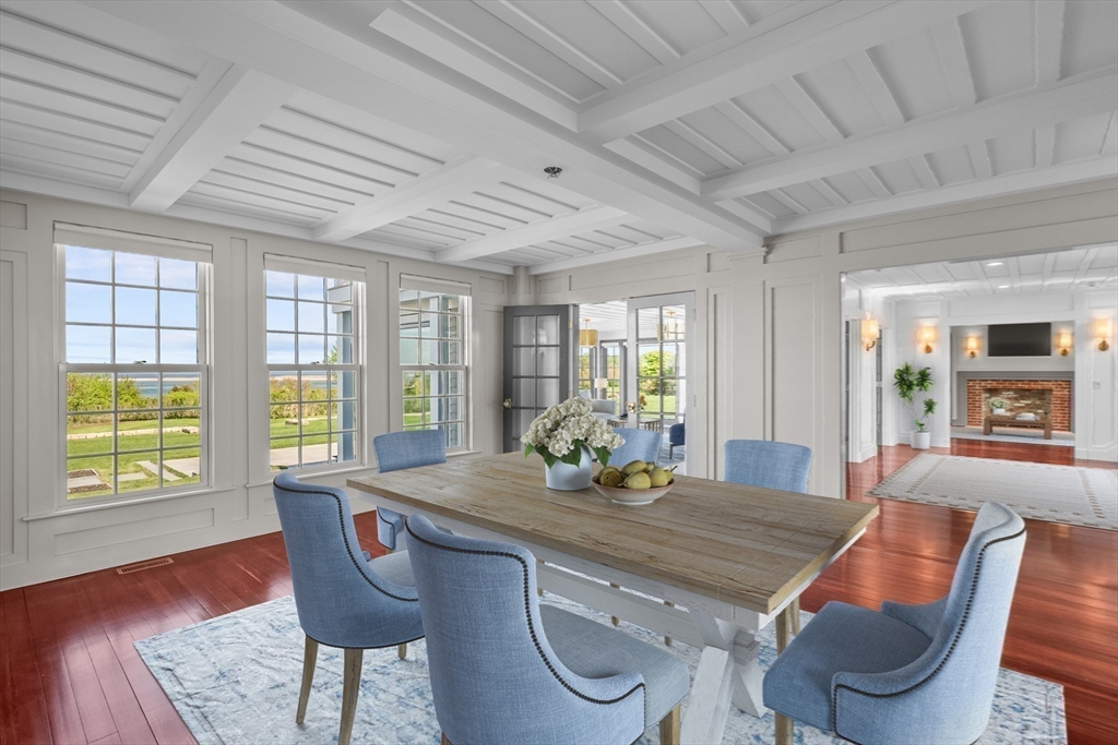 108 Shore Road Chatham, MA 02633 - Photo 19 of 32 a dining room with furniture a rug and wooden floor