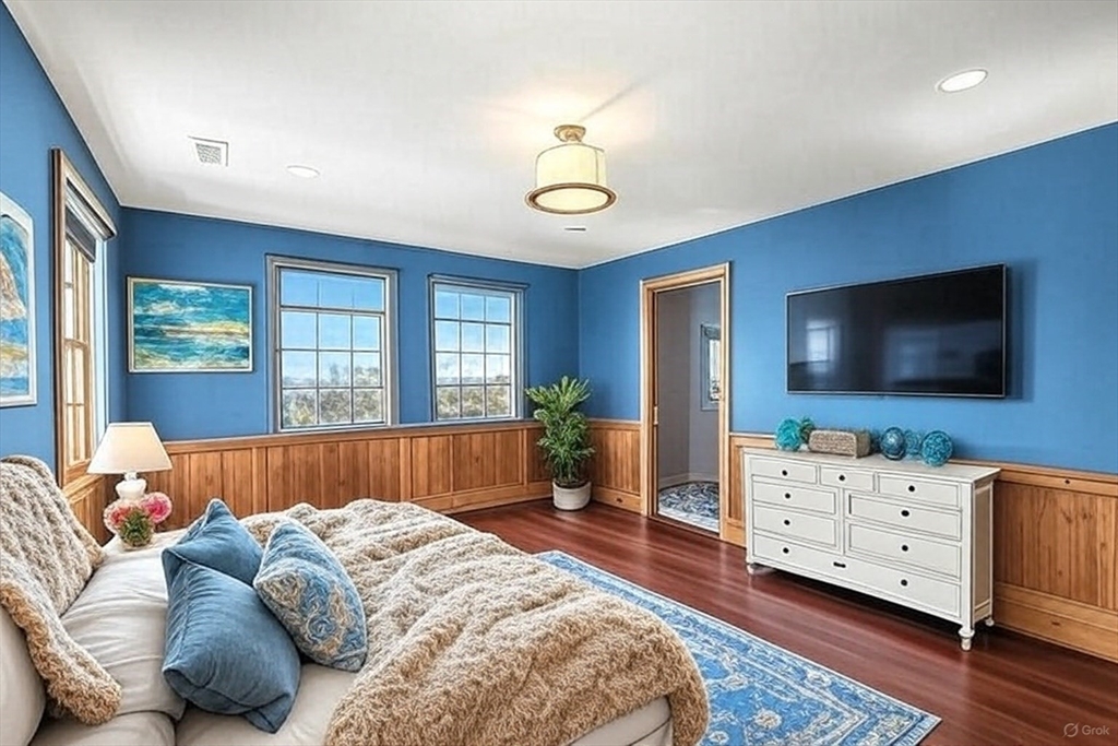 108 Shore Road Chatham, MA 02633 - Photo 25 of 32 a bedroom with furniture and a flat screen tv