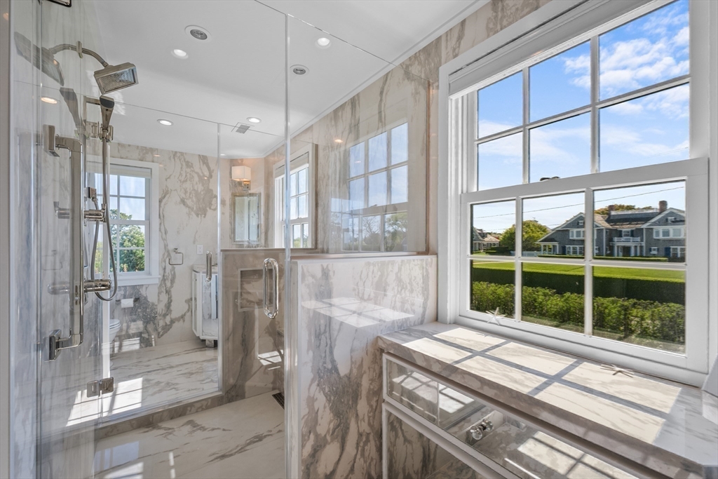 108 Shore Road Chatham, MA 02633 - Photo 26 of 32 a kitchen view with a large window and stainless steel appliances