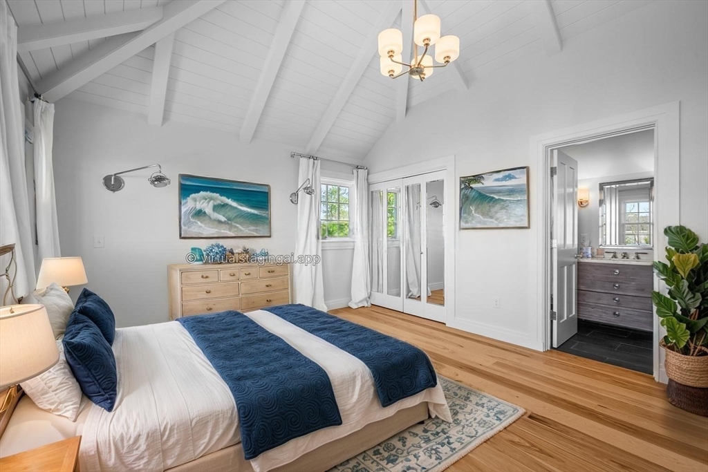 108 Shore Road Chatham, MA 02633 - Photo 31 of 32 a bedroom with a bed chandelier and a window