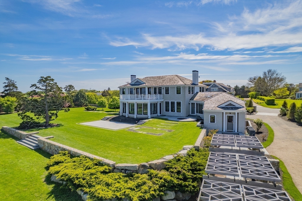 108 Shore Road Chatham, MA 02633 - Photo 4 of 32 a view of a house with a big yard and large trees