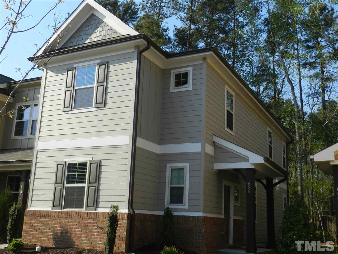 688 Wickham Ridge Road Apex, NC 27539 - Photo 2 of 20 a house that has a tree in front of the house