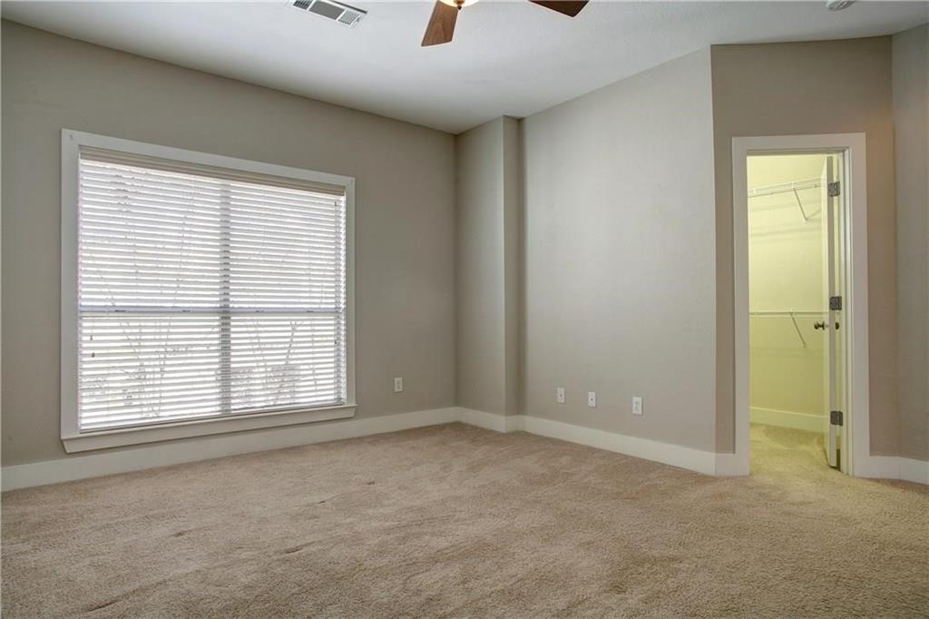 4830 Cedar Springs Road, Unit 43 Dallas, TX 75219 - Photo 13 of 22 Unfurnished room featuring light colored carpet and ceiling fan