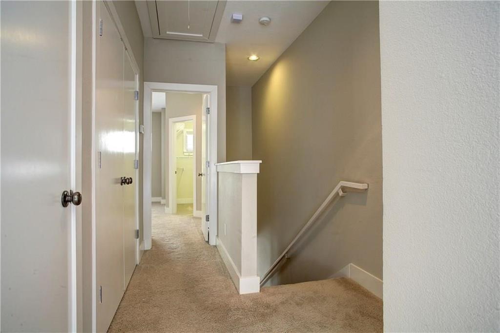 4830 Cedar Springs Road, Unit 43 Dallas, TX 75219 - Photo 14 of 22 Corridor featuring light colored carpet