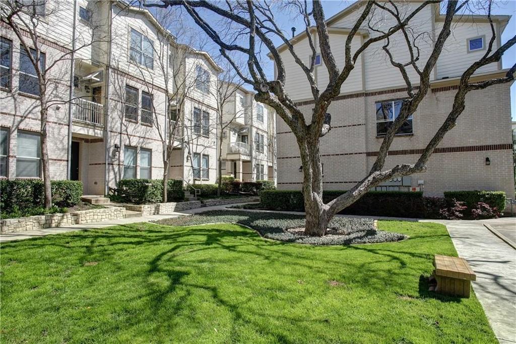 4830 Cedar Springs Road, Unit 43 Dallas, TX 75219 - Photo 20 of 22 View of property's community featuring a lawn