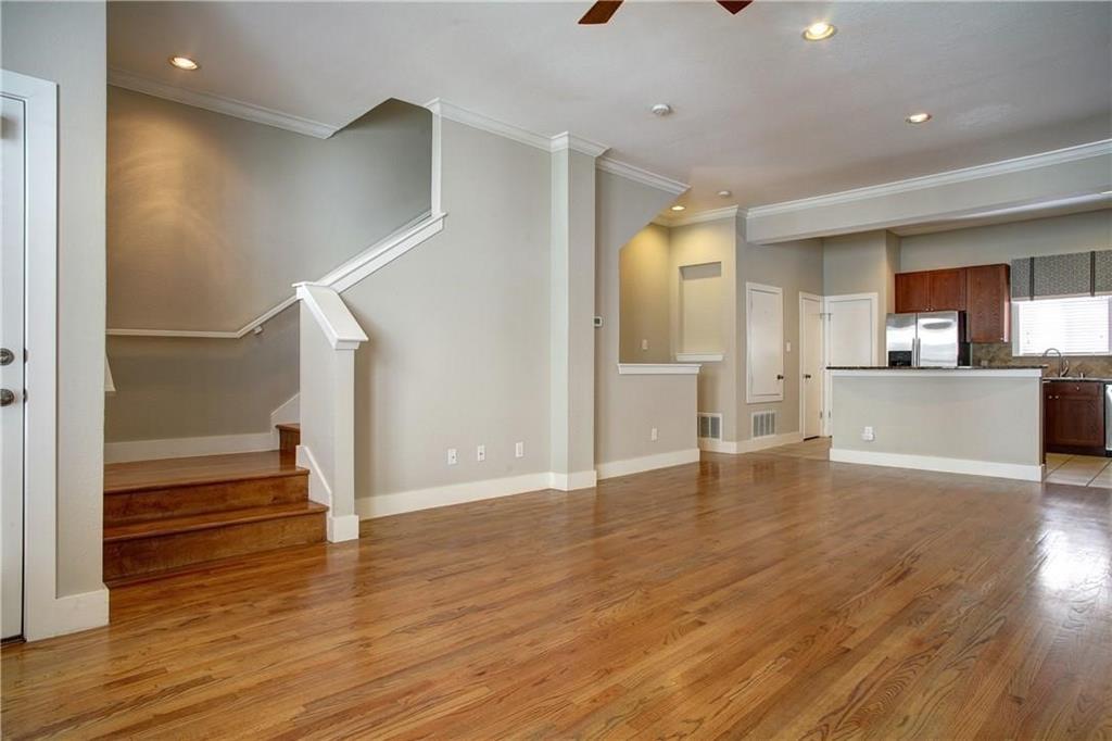 4830 Cedar Springs Road, Unit 43 Dallas, TX 75219 - Photo 5 of 22 Unfurnished living room with sink, ceiling fan, light hardwood / wood-style floors, and ornamental molding