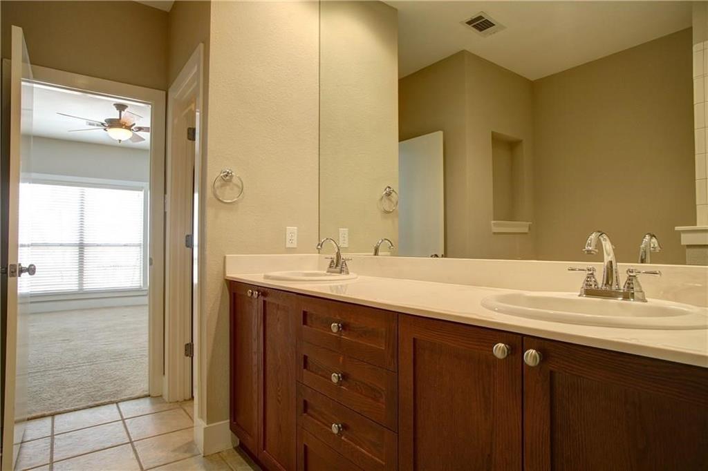 4830 Cedar Springs Road, Unit 43 Dallas, TX 75219 - Photo 10 of 22 Bathroom with double vanity, tile floors, and ceiling fan