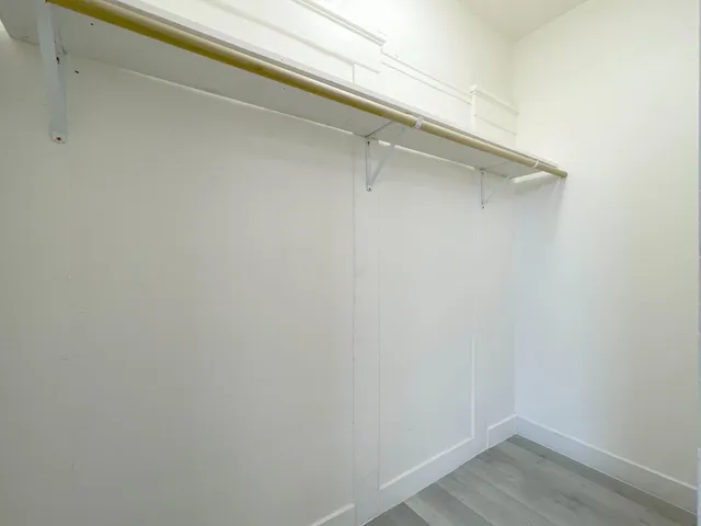 a view of a kitchen with a refrigerator and a refrigerator