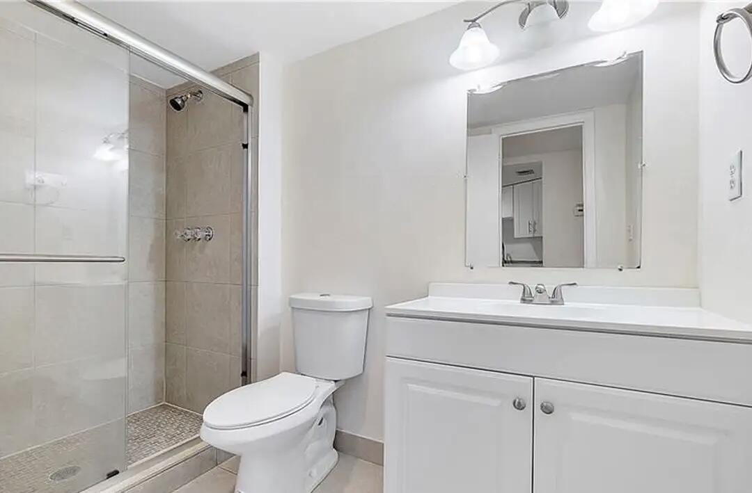 6921 Environ Boulevard, Unit 6S Lauderhill, FL 33319 - Photo 8 of 9 a bathroom with a sink toilet and shower
