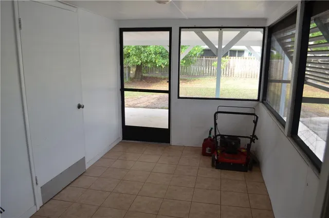 a view of room with window and furniture