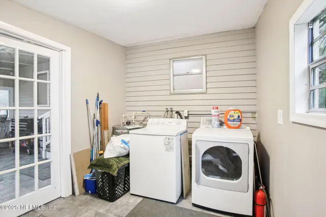 a utility room with dryer and washer