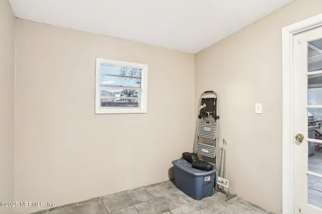a view of a hallway with a potted plant
