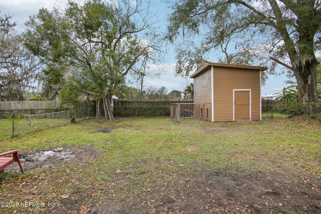 a backyard of a house with lots of green space